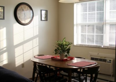 Dining room with table and chairs in Wedgefield apartment